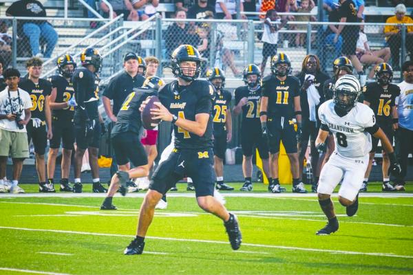 Monitor Photo/Russell Slaton Malakoff quarterback Canyon Marsh delivers a first-half pass on his way to a 376-yard performance versus the Grandview Zebras, tossing three touchdowns.