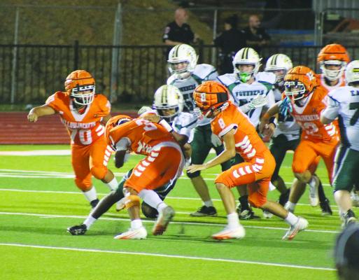 Monitor Photo/Blaine Clamon Zaki Brown (No. 3) tackles the Founders Classical quarterback during Kemp’s Oct. 2 Homecoming game.