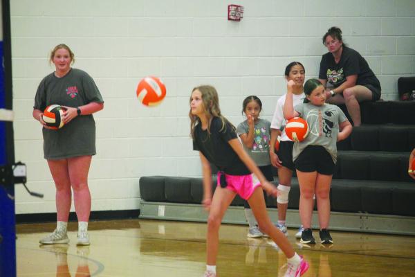 Monitor Photo/Russell Slaton Kemp ISD student Elaina Lockwood keeps her eye on the volleyball as she learns the sport’s serving skills in the Kemp ISD gymnasium.