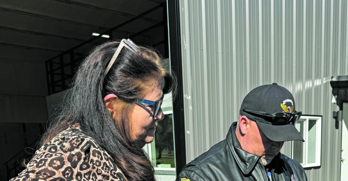 courtesy photo City of Tool Mayor Vera Bennett (left) and Chief of Police Robert Walker look at the petition that was served, concerning a wrongful death lawsuit, involving Tool Police officer Oct 21.