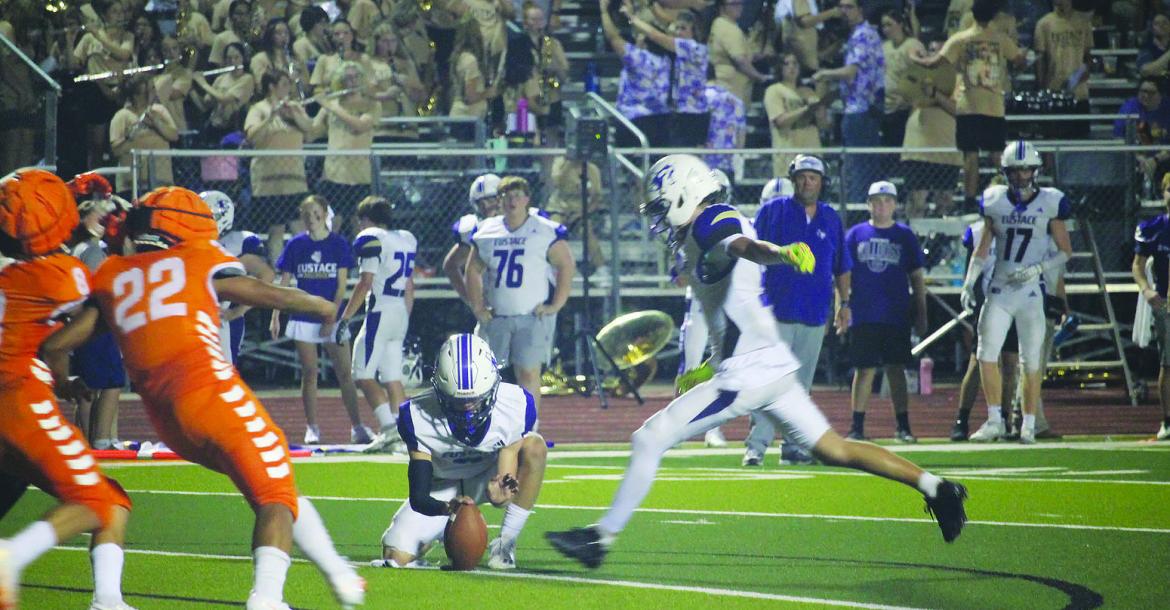 Monitor Photo/Russell Slaton Ryne Dowell of Eustace kicks the extra point following the final touchdown of the night for his team, which gave new Eustace head coach Phillip Smith his first win.