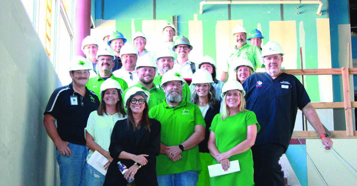 Monitor Photo/Carla Gray Mabank ISD board of trustees, principal and staff tour the third and fourth grade elementary school building. A slide will be placed beside the stairs for those fun days at school